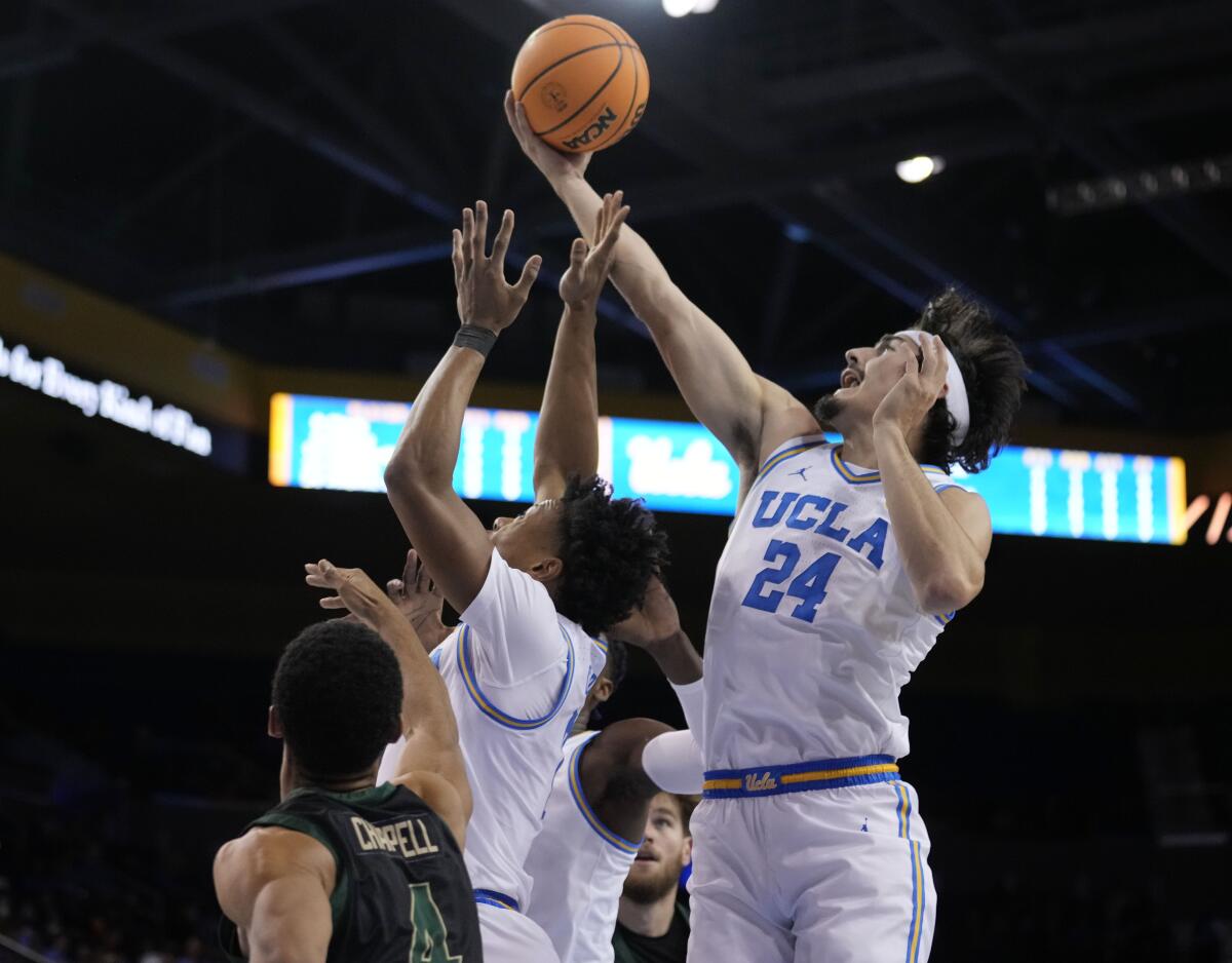 UCLA's Jaime Jaquez Jr. jumps to catch a rebound 
