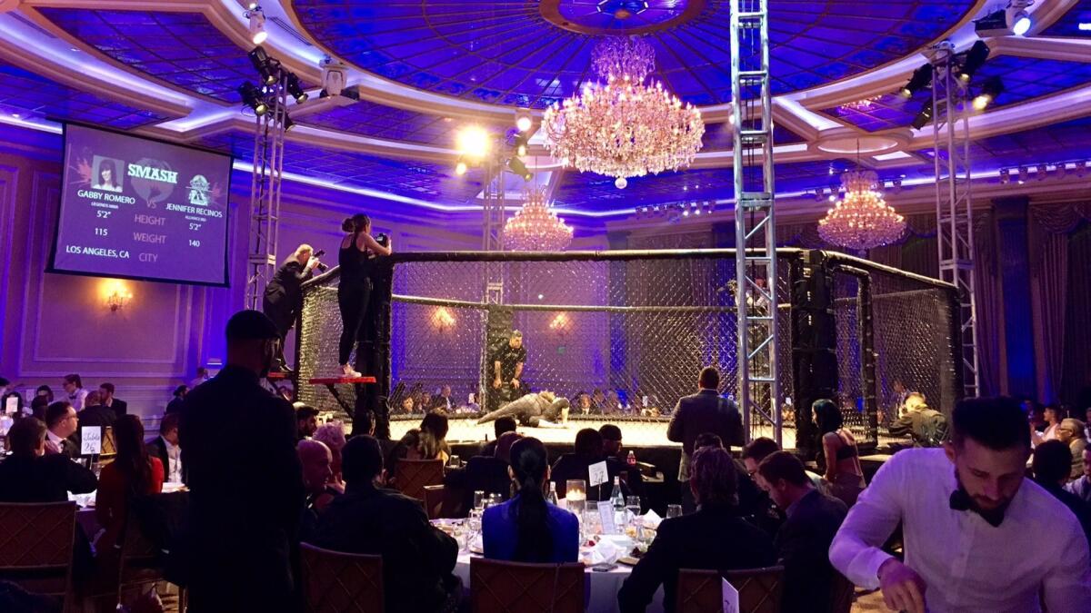 Guests dine ringside as MMA fighters brawl at the SMASH Global Pre-Oscars gala.