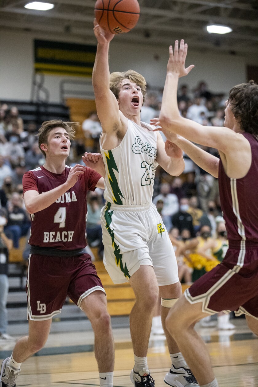 Edison's Tucker Tripp passes the ball during a Surf League boys' basketball game against Laguna Beach on Wednesday.