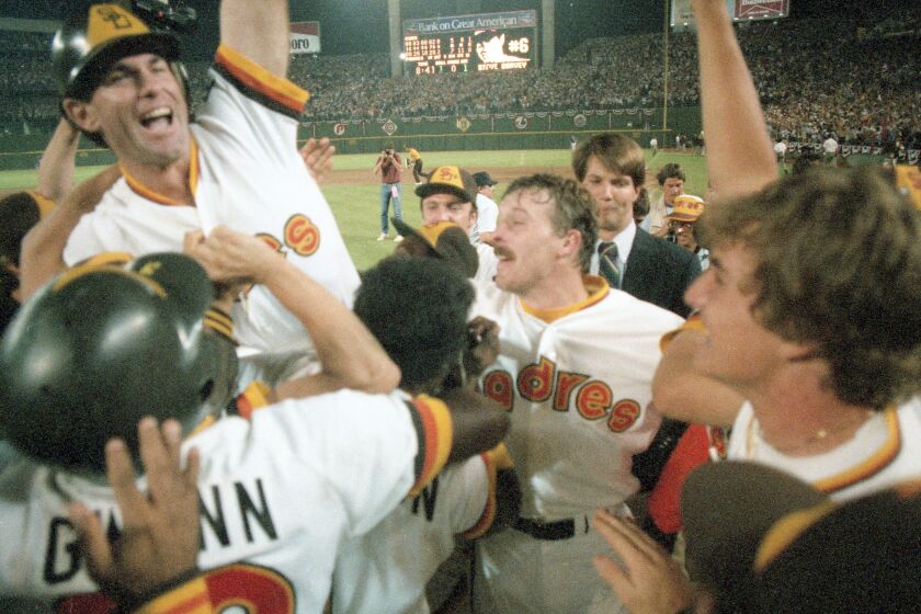 Teammates give Steve Garvey a boost after he hit a game-winning home run to boost the Padres past the Cubs 7-5 to tie the series at two games each. (Thane McIntosh/San Diego Union-Tribune) User Upload Caption: Padres 1984 NLCS playoffs game 4