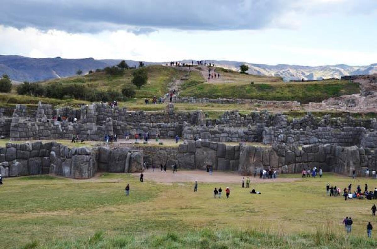 The Sacsayhuaman ruins attract travelers on their way to Machu Picchu.
