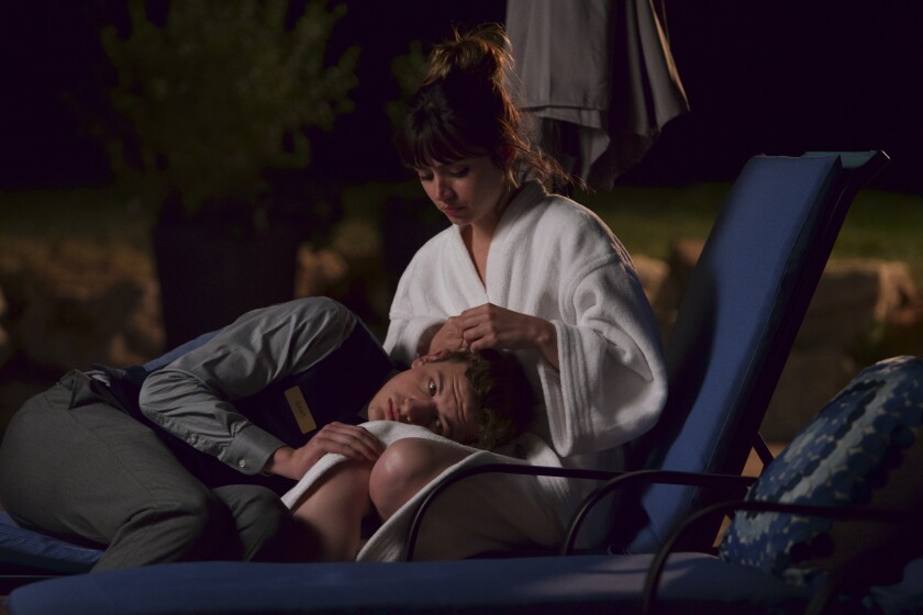 Tye Sheridan and Ana de Armas in  the movie "The Night Clerk."