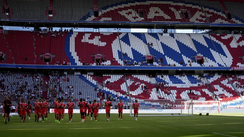 FILE - Bayern Munich players warm up for a training session after a team presentation for the upcoming German Bundesliga soccer season at the Allianz Arena stadium in Munich, Germany, on July 16, 2022. (AP Photo/Matthias Schrader, File)