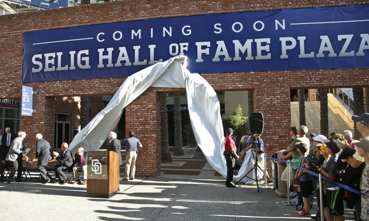 In an Aug. 26 ceremony that caused quite a furor in San Diego, Bud Selig (left) turns to see the unveiling of a sign announcing that the Padres were renaming a part of Petco Park in honor of the soon-to-retire commissioner.