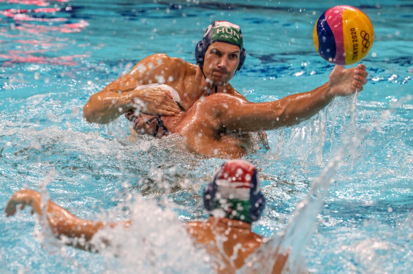 U.S. forward Ben Hallock is pushed down in the water by Hungary driver Denes Varga