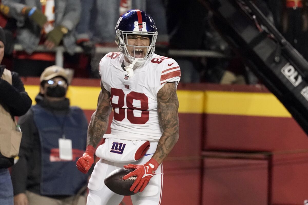 New York Giants tight end Evan Engram celebrates after scoring during the second half of an NFL football game against the Kansas City Chiefs Monday, Nov. 1, 2021, in Kansas City, Mo. (AP Photo/Charlie Riedel)