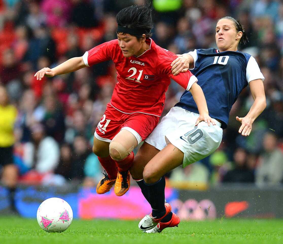 U.S. midfielder Carli Lloyd, right, gets physical with North Korea's Kim Su Gyong during the London 2012 Olympic Games.
