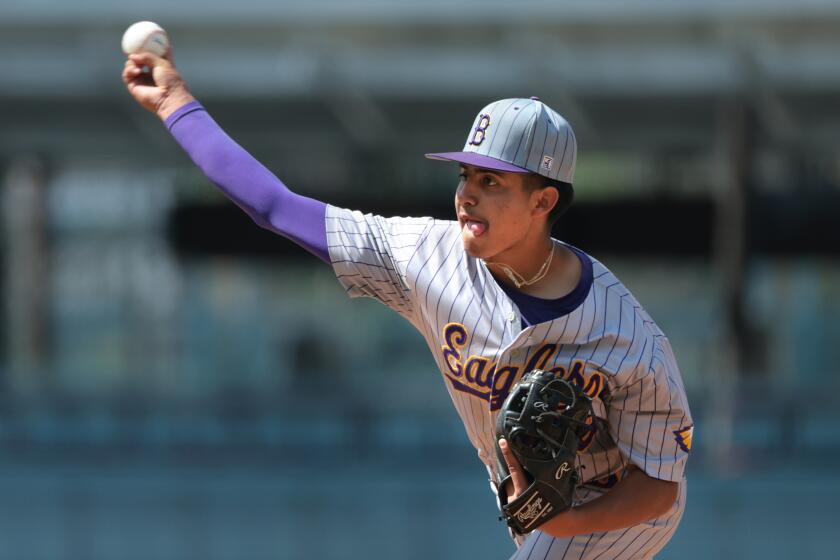 LOS ANGELES, CALIFORNIA May 25, 2024- Bell pitcher Jayden Rojas throws a pitch against Birmingham in the City Section Open Division championship at Dodger Stadium Saturday. (Wally Skalij/Los Angeles Times)