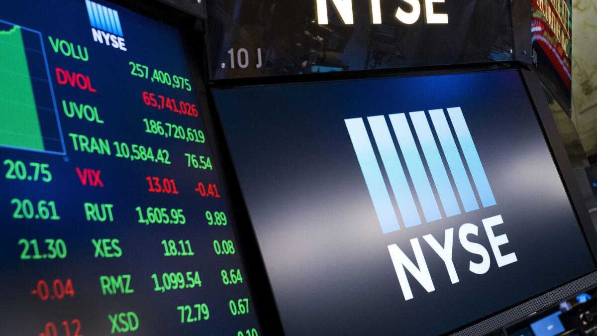 Screens show prices at the New York Stock Exchange.