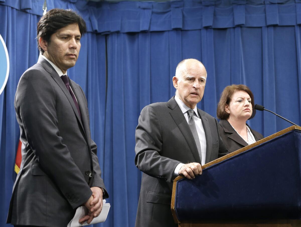 California Gov. Jerry Brown, with Senate President Pro Tem Kevin de Leon, D-Los Angeles, left, and Assembly Speaker Toni Atkins, D-San Diego, in June.