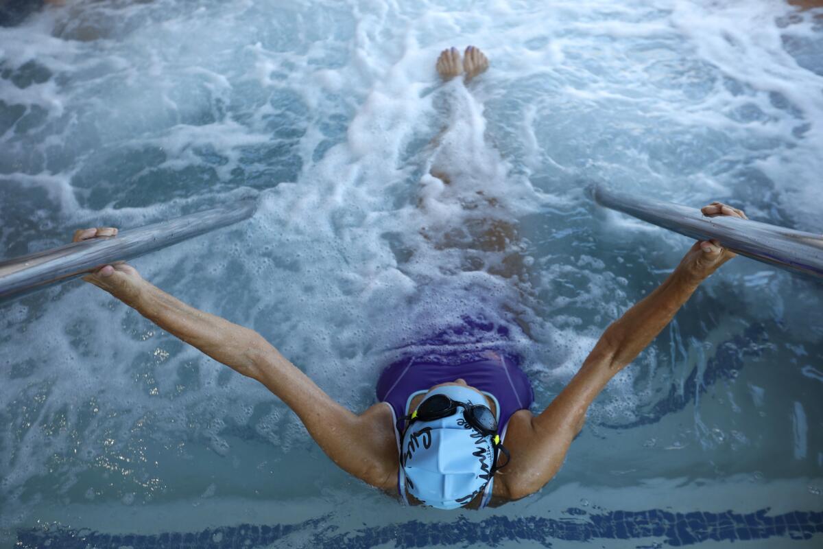 Maurine Kornfeld soaks in the hot tub after swim practice at the Rose Bowl Aquatics Center in Pasadena.