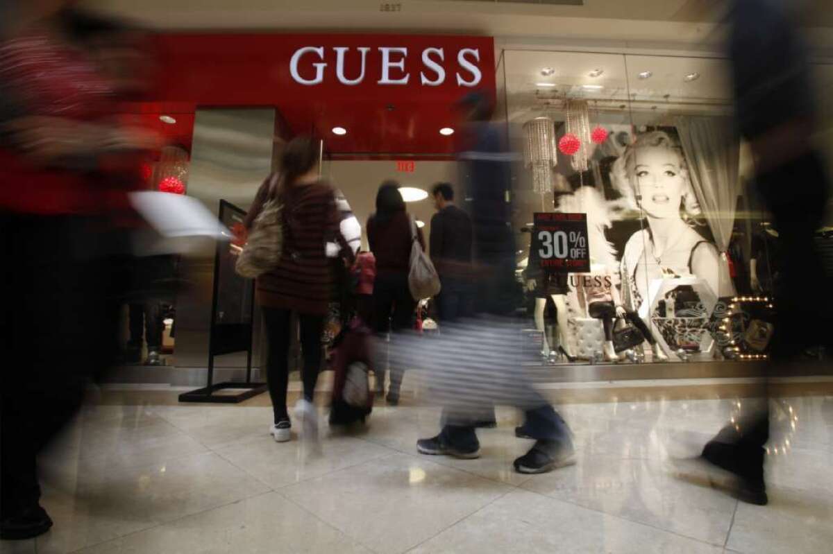 Guess Inc. said it expects to lose between 5 cents and 9 cents a share in its fiscal first quarter. Above, a Guess store at South Coast Plaza in Costa Mesa in 2011.