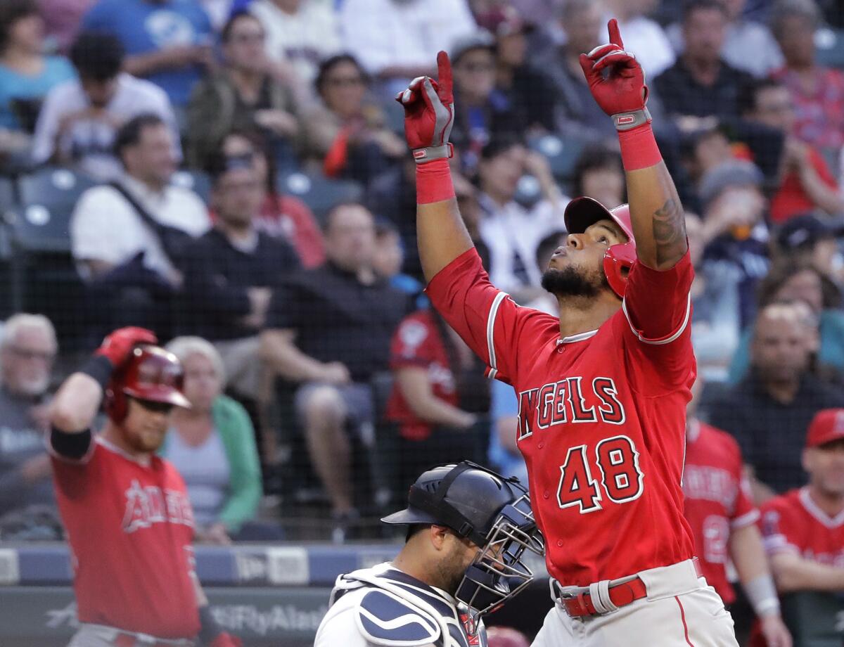 Angels' Cesar Puello (48) reacts as he crosses the plate after hitting a solo home run during the third inning against the Seattle Mariners on Thursday in Seattle.