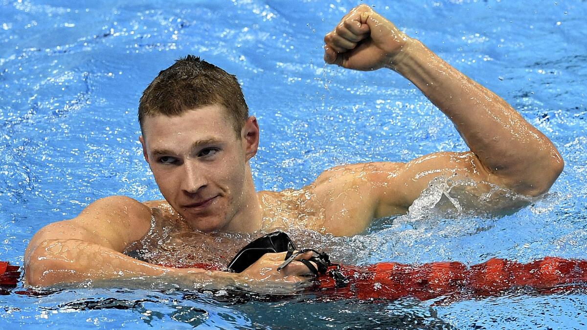 American swimmer Ryan Murphy celebrates after winning the gold medal in the men's 100-meter backstroke on Monday.