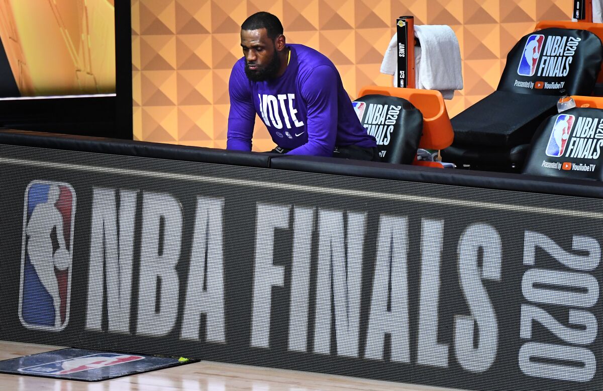Lakers' LeBron James sits alone before Game 5 of the NBA Finals in Orlando.