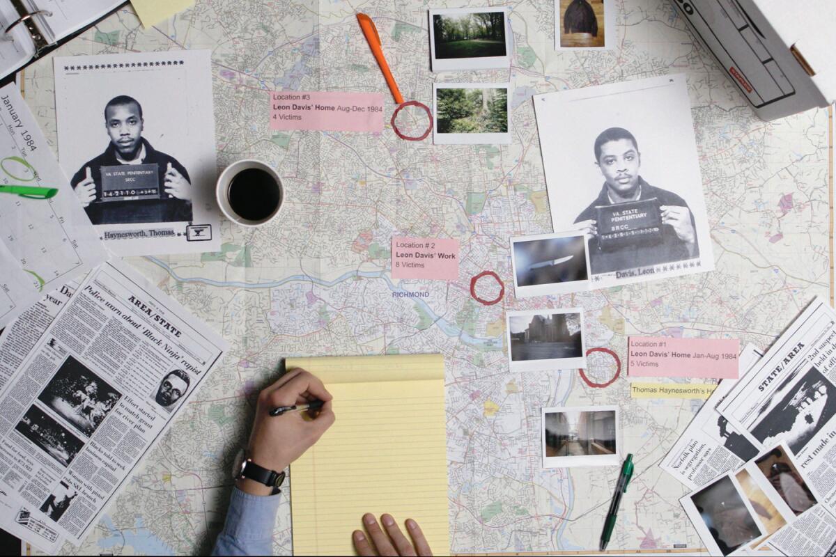 A map covered with pictures of suspects and a notepad