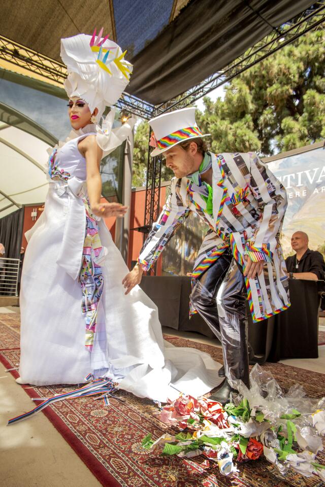 Hummingbird Meadows and Eli James Wanket model wedding outfits by Brad Elsberry. The duo won the Most Creative Concept and People's Choice awards at Sunday's Festival of Arts fashion show.