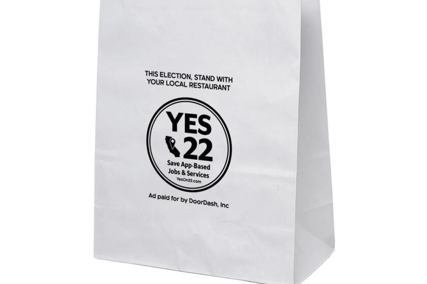 White paper bag emblazoned with "Yes 22. Save App-Based Jobs & Services" in a large circle. "Ad paid for by DoorDash" below.