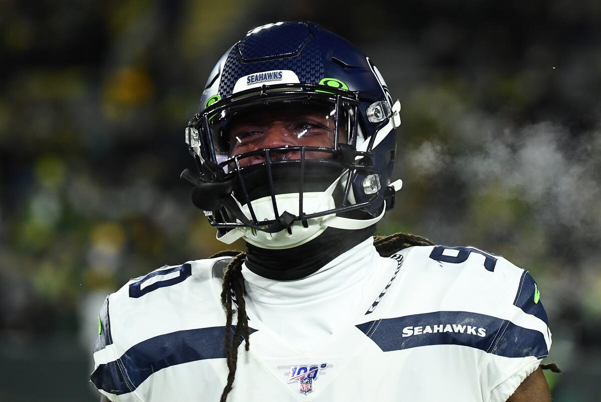 Seahawks defensive end Jadeveon Clowney looks on before a playoff game against the Packers on Jan. 12, 2020.
