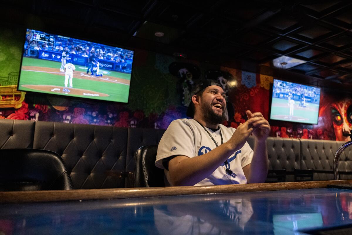 Former Los Angeles resident Gabriel Vasquez watches Game 1 of the NLDS at La Catrina Bar & Grill in Las Vegas.