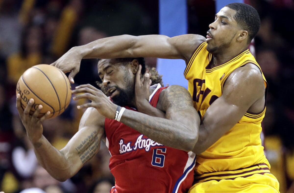 Clippers center DeAndre Jordan (6) takes the worse of a rebound battle with Cavaliers power forward Tristan Thompson on Saturday night.