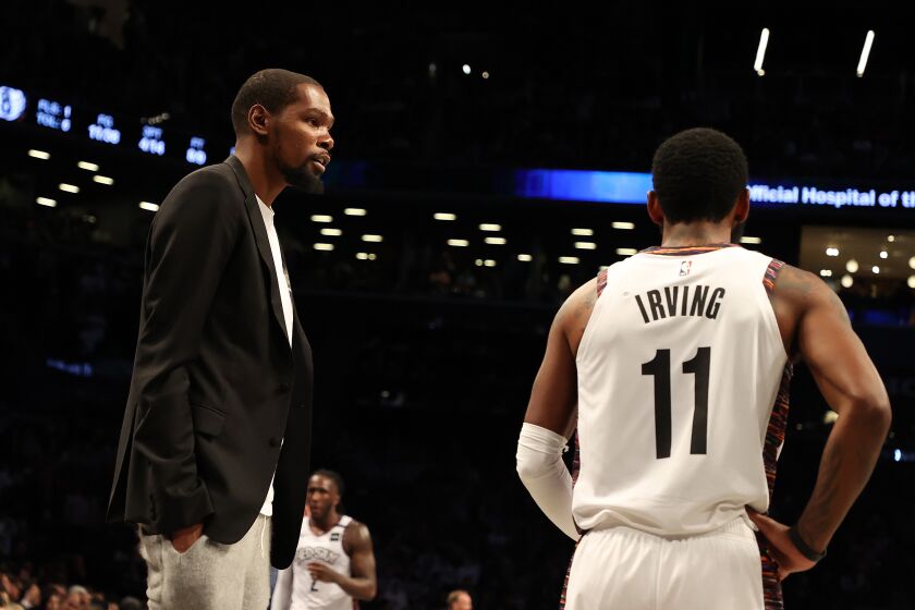 NEW YORK, NEW YORK - JANUARY 18: Kevin Durant #7 of the Brooklyn Nets talks to Kyrie Irving #11 of the Brooklyn Nets during their game against the Milwaukee Bucksat Barclays Center on January 18, 2020 in New York City. NOTE TO USER: User expressly acknowledges and agrees that, by downloading and/or using this photograph, user is consenting to the terms and conditions of the Getty Images License Agreement. (Photo by Al Bello/Getty Images)