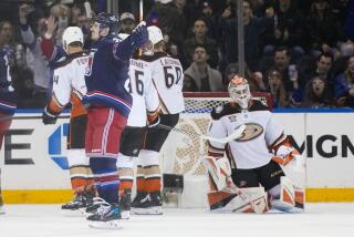 New York Rangers' Chris Kreider, front left, reacts after scoring on Anaheim Ducks.