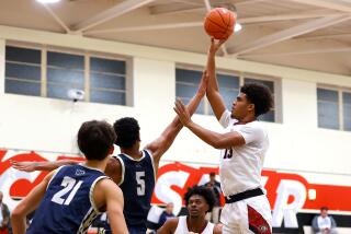 Corona Centennial's Eric Freeny, a UCLA signee, puts up shot against West Ranch. He finished with 31 points.