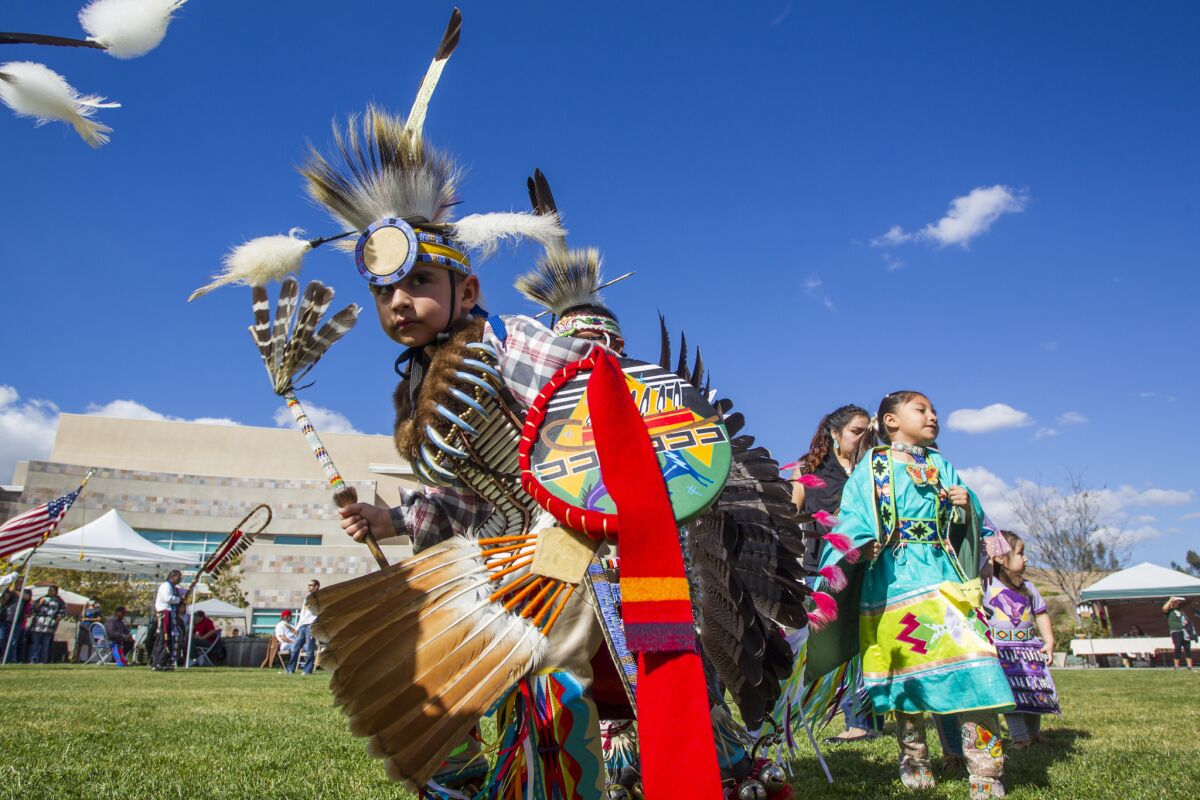 Dancers of all ages makes their way around the procession during the grand entry at Cuyamaca College's third annual powwow in 2017.