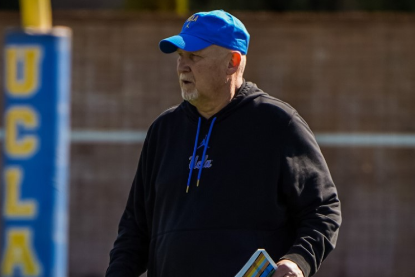 UCLA defensive coordinator Bill McGovern walks on a practice field in 2022.