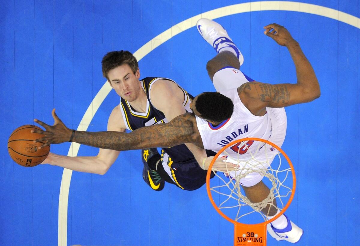 Utah Jazz guard Gordon Hayward, left, tries to put up a shot over Clippers center DeAndre Jordan during a game at Staples Center on Feb. 1, 2014.