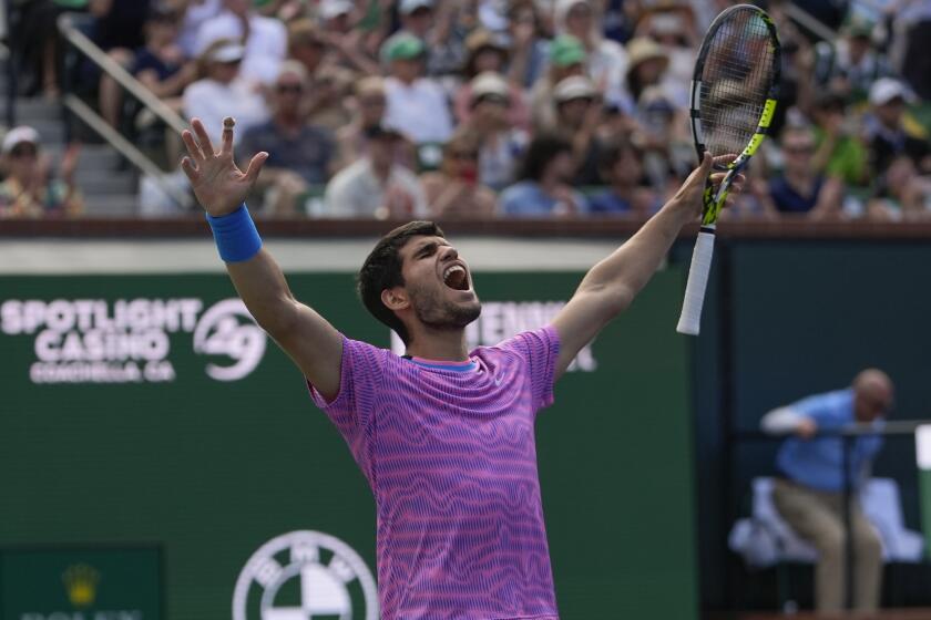 Carlos Alcaraz, of Spain, celebrates after defeating Daniil Medvedev, of Russia.