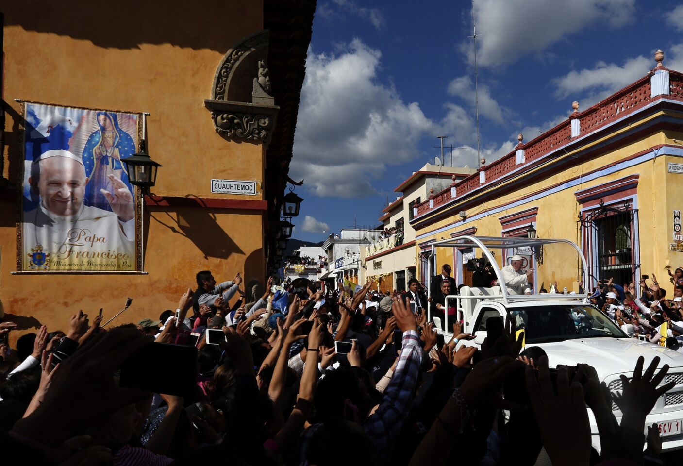 After a Mass that included several Mayan languages, Pope Francis is driven through San Cristobal de las Casas in southern Mexico.