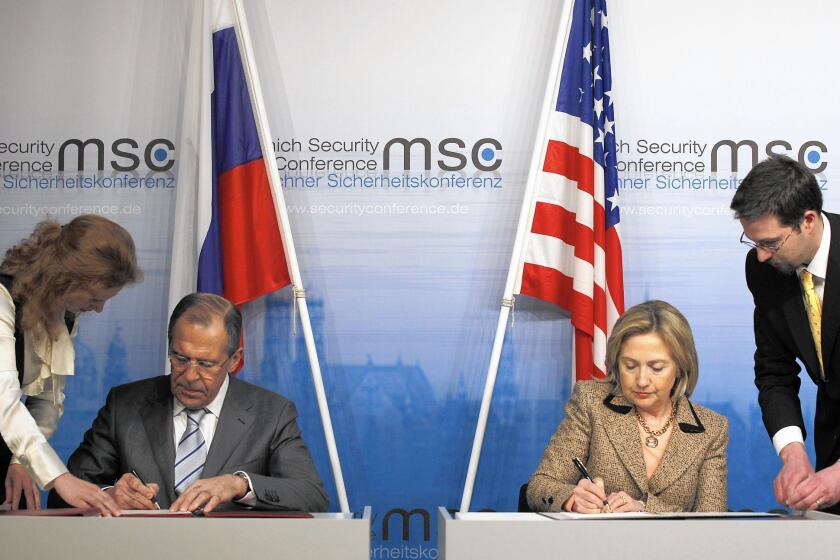Russian Foreign Minister Sergei Lavrov and then-U.S. Secretary of State Hillary Rodham Clinton finalize the New START treaty in February 2011 in Munich, Germany.