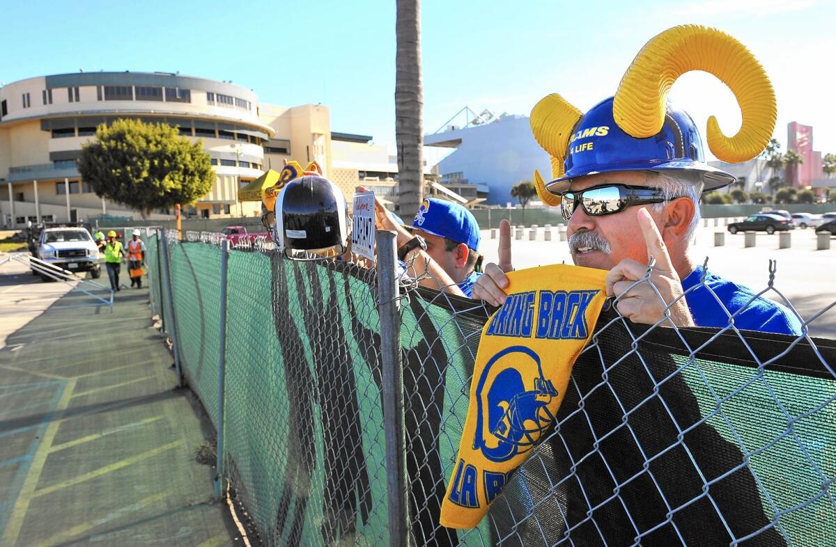 St. Louis Rams owner Stan Kroenke is a partner in the proposed 80,000-seat football stadium in Inglewood. Above, Rams fans visited Hollywood Park after the plan to build the stadium at the racetrack site was announced in January.