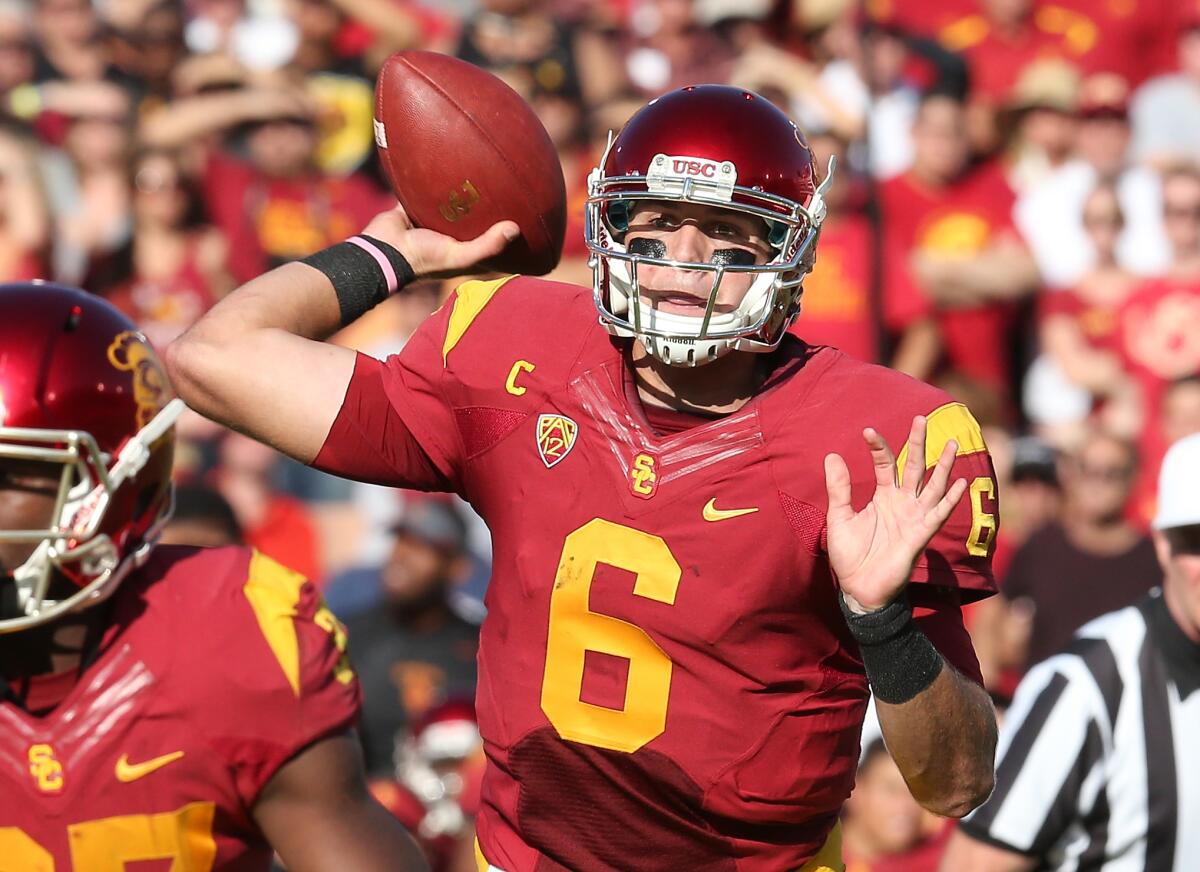 USC quarterback Cody Kessler throws a seven-yard touchdown pass to JuJu Smith-Schuster against Colorado on Oct. 18, 2014.