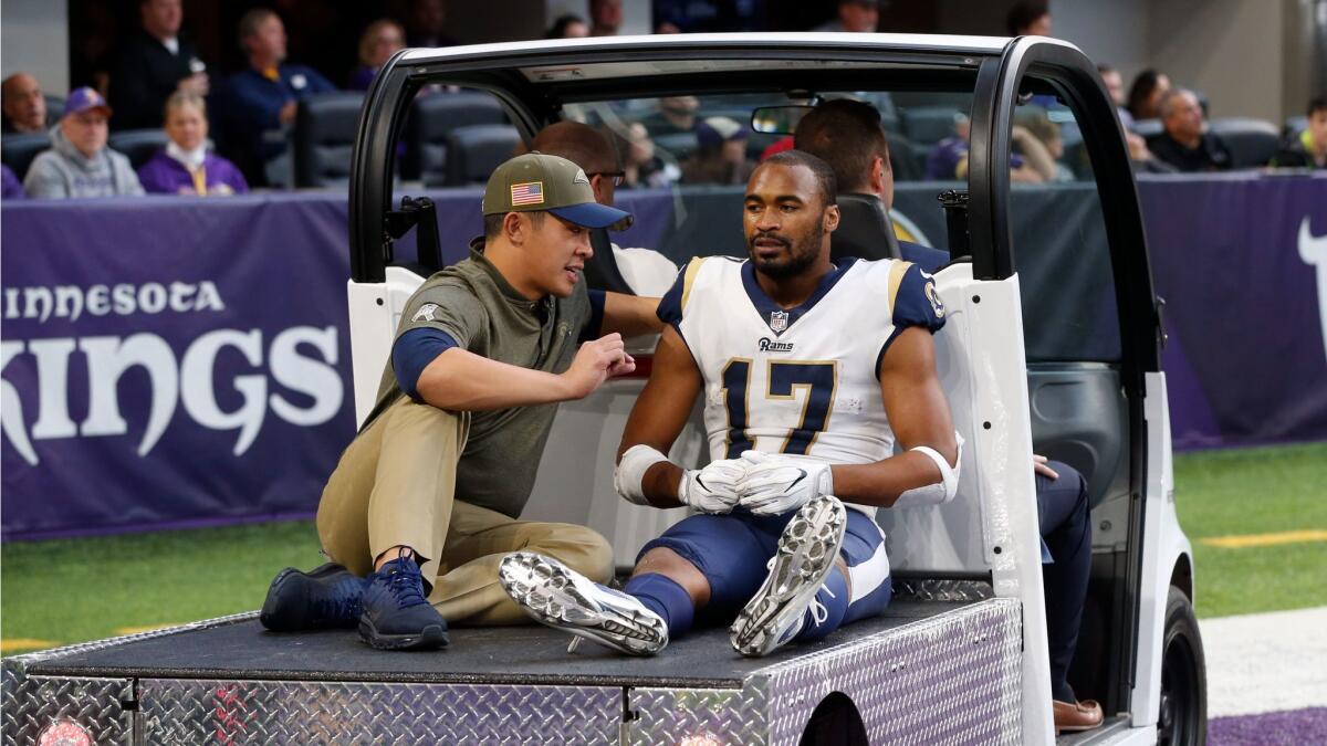 Los Angeles Rams wide receiver Robert Woods is carted off the field after getting injured during the second half against the Minnesota Vikings.