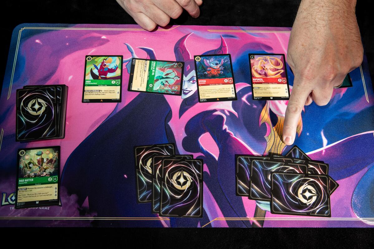 Cards on a board that features Disney witches