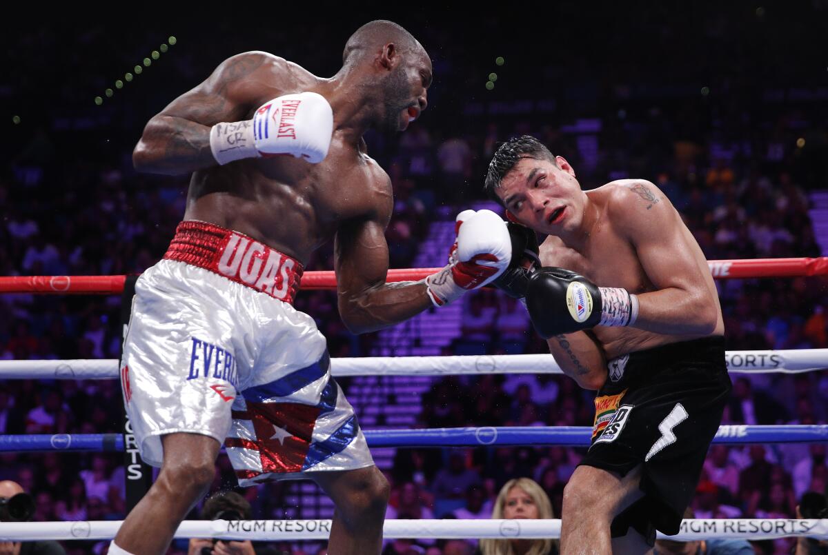 Yordenis Ugás, left, lands a punch against Omar Figueroa Jr. during a July 2019 welterweight fight in Las Vegas.