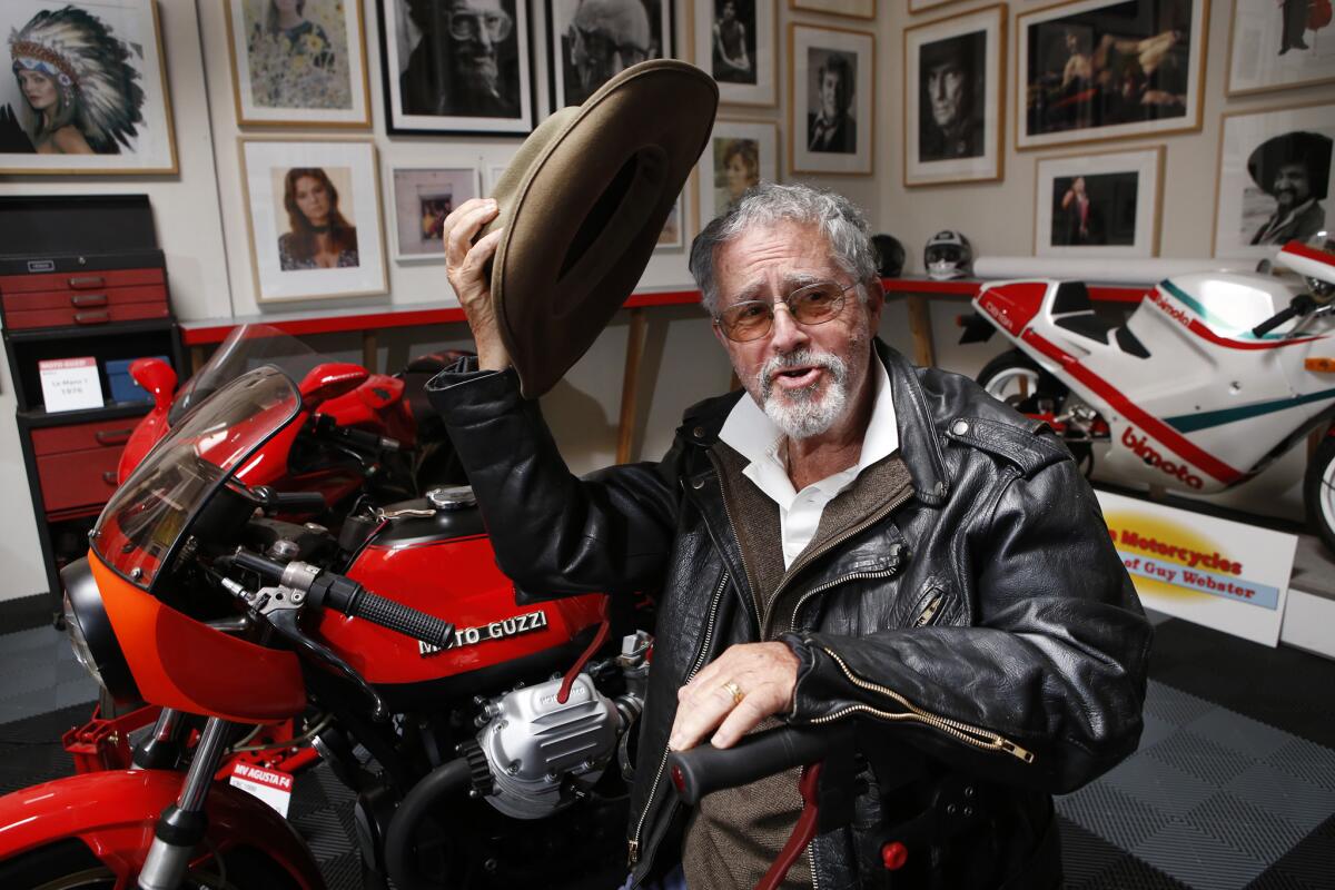 Guy Webster, in his Ojai studio, is surrounded by his favorite motorcycles and pictures he took of his favorite Hollywood stars.