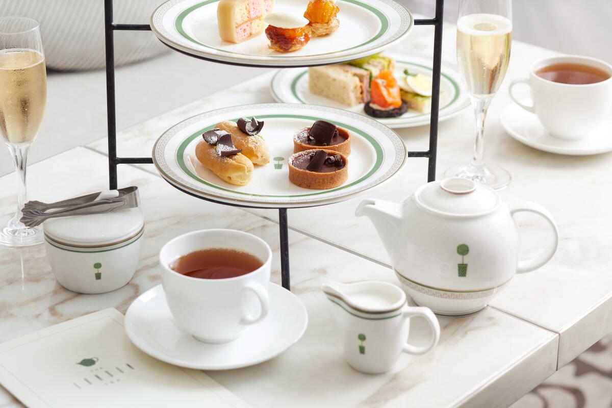 tiered pastry tray with white tea set