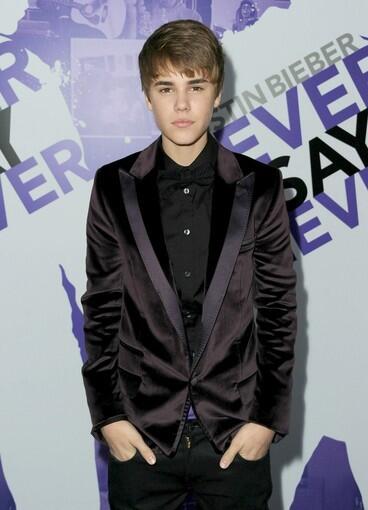 Singer Justin Bieber walks the red carpet at the Los Angeles premiere of his new film, "Justin Bieber: Never Say Never." His outfit is from fashion label D&G.