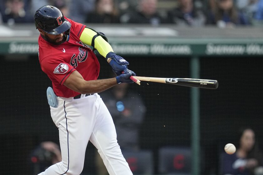 Cleveland Guardians' Amed Rosario hits a broken-bat single against the Boston Red Sox during the fourth inning of a baseball game Wednesday, June 7, 2023, in Cleveland. (AP Photo/Sue Ogrocki)