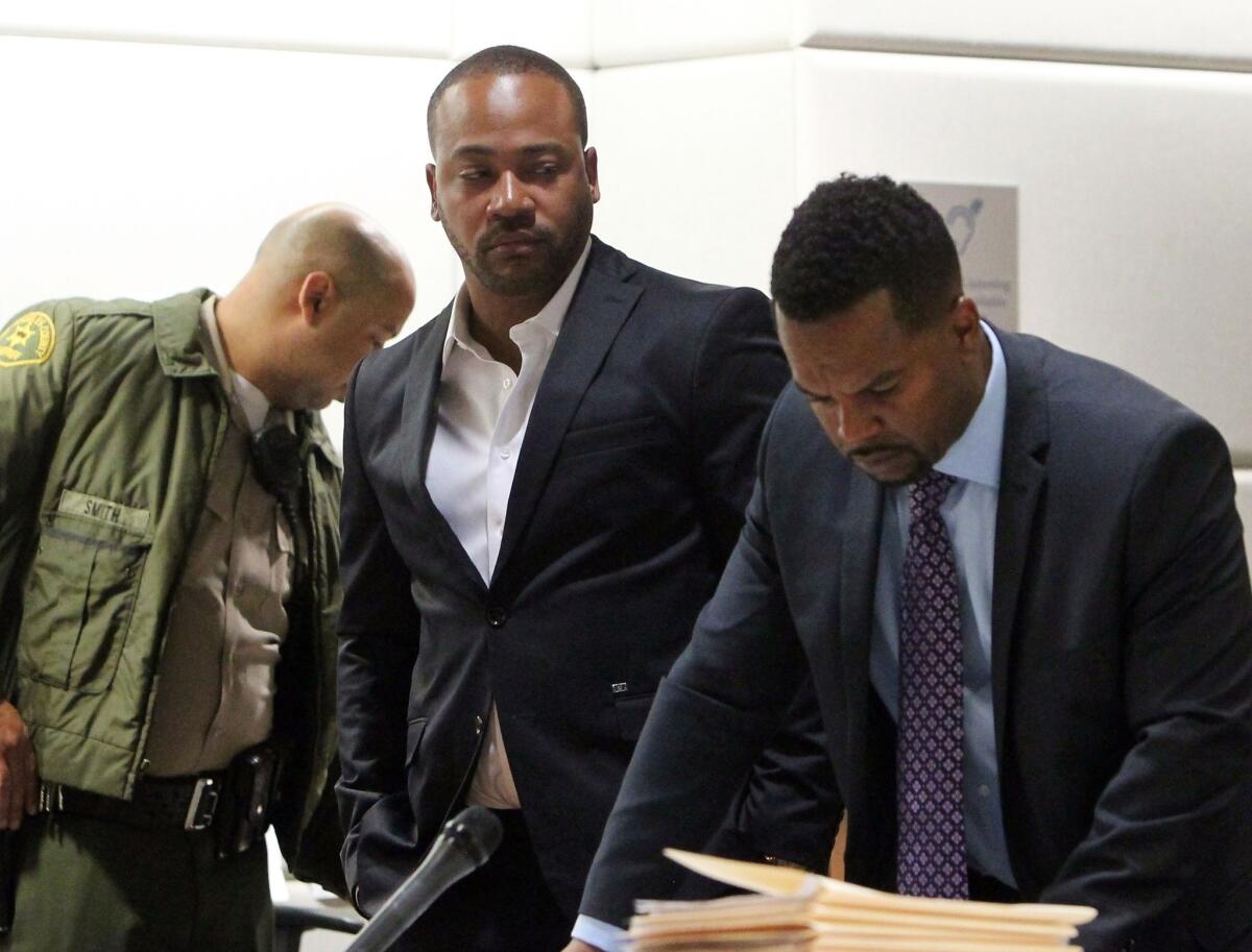 Columbus Short, left, appears with his lawyer Jeff Jacquet at Los Angeles Superior Court on Thursday.