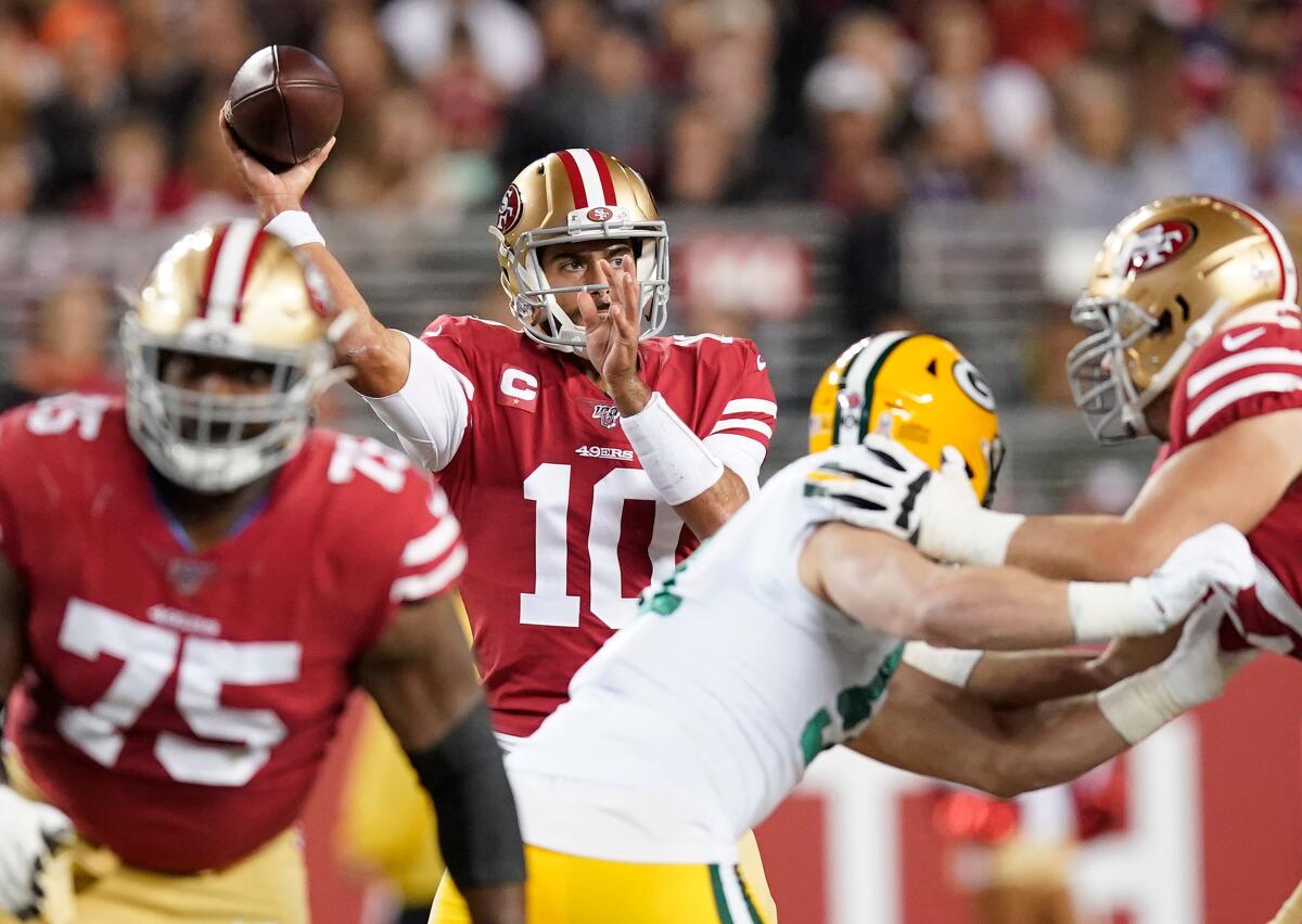 San Francisco 49ers quarterback Jimmy Garoppolo passes against the Green Bay Packers during the first half on Nov. 24, 2019 in Santa Clara.