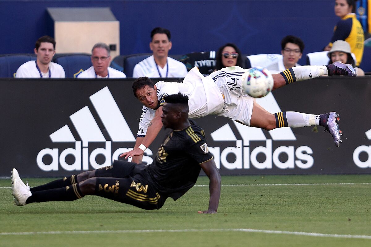 LAFC's Jesús Murillo (3) defends against the Galaxy's Javier Hernández during the second half April 9, 2022.