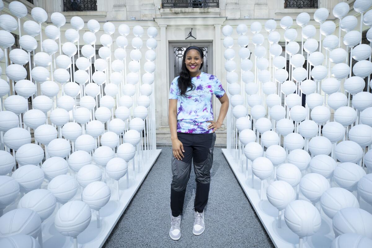 Maya Moore poses for a photo at the House of Jumpman in Paris.
