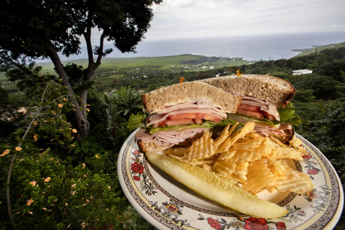 Enjoy the Black forest ham and smoked turkey sandwich — and the views — at the Coffee Shack in Captain Cook, Hawaii.