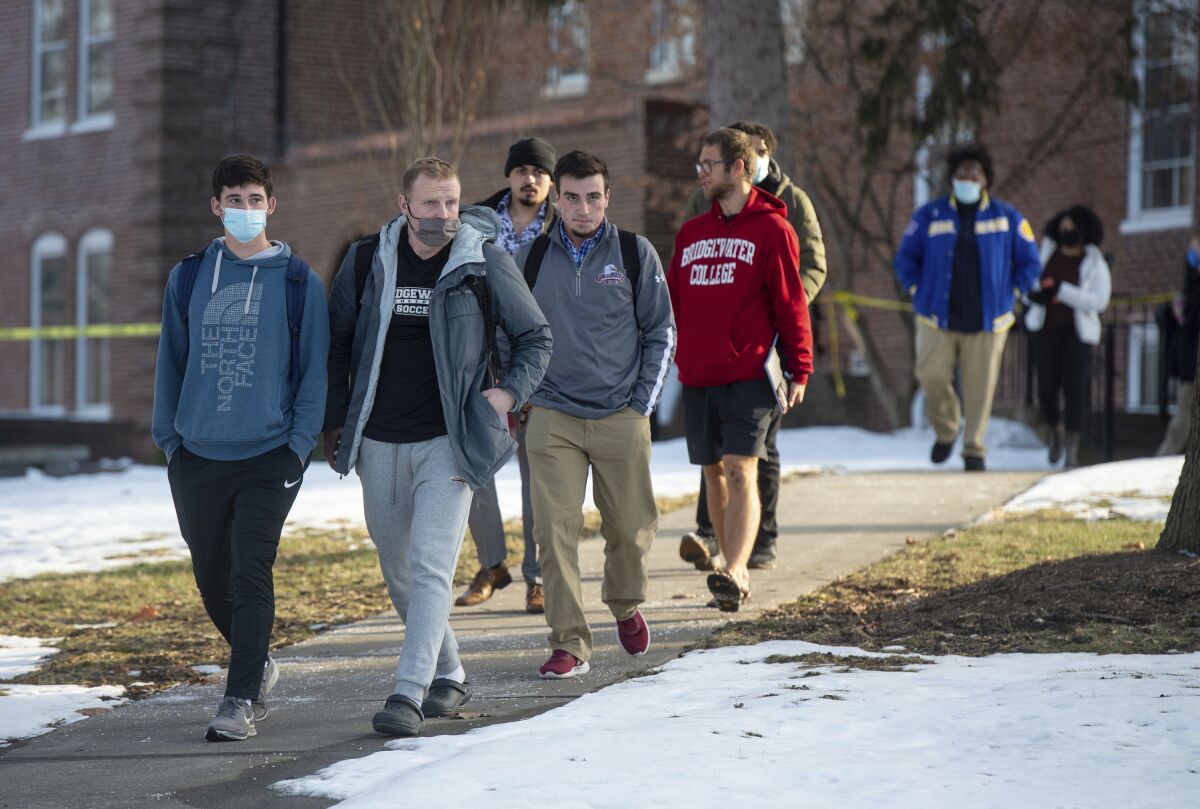 Students exit Flory Hall on the campus of Bridgewater College following a shooting that claimed the lives of a campus police officer and a campus security officer in Bridgewater, Va., Tuesday, Feb. 1, 2022. (Daniel Lin/Daily News-Record via AP)