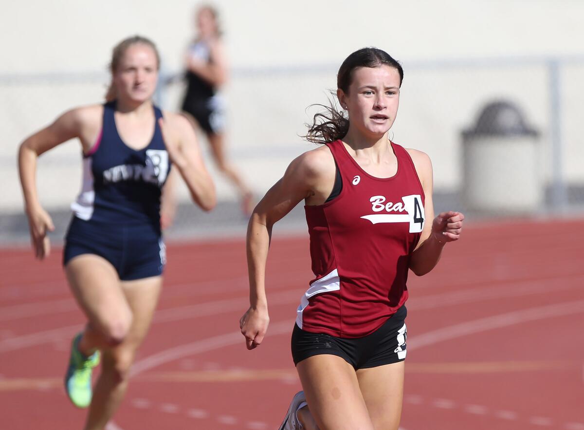 Laguna Beach's Majia Shaw (4) runs down the final stretch of the 400-meter event in the Wave League finals on April 25.